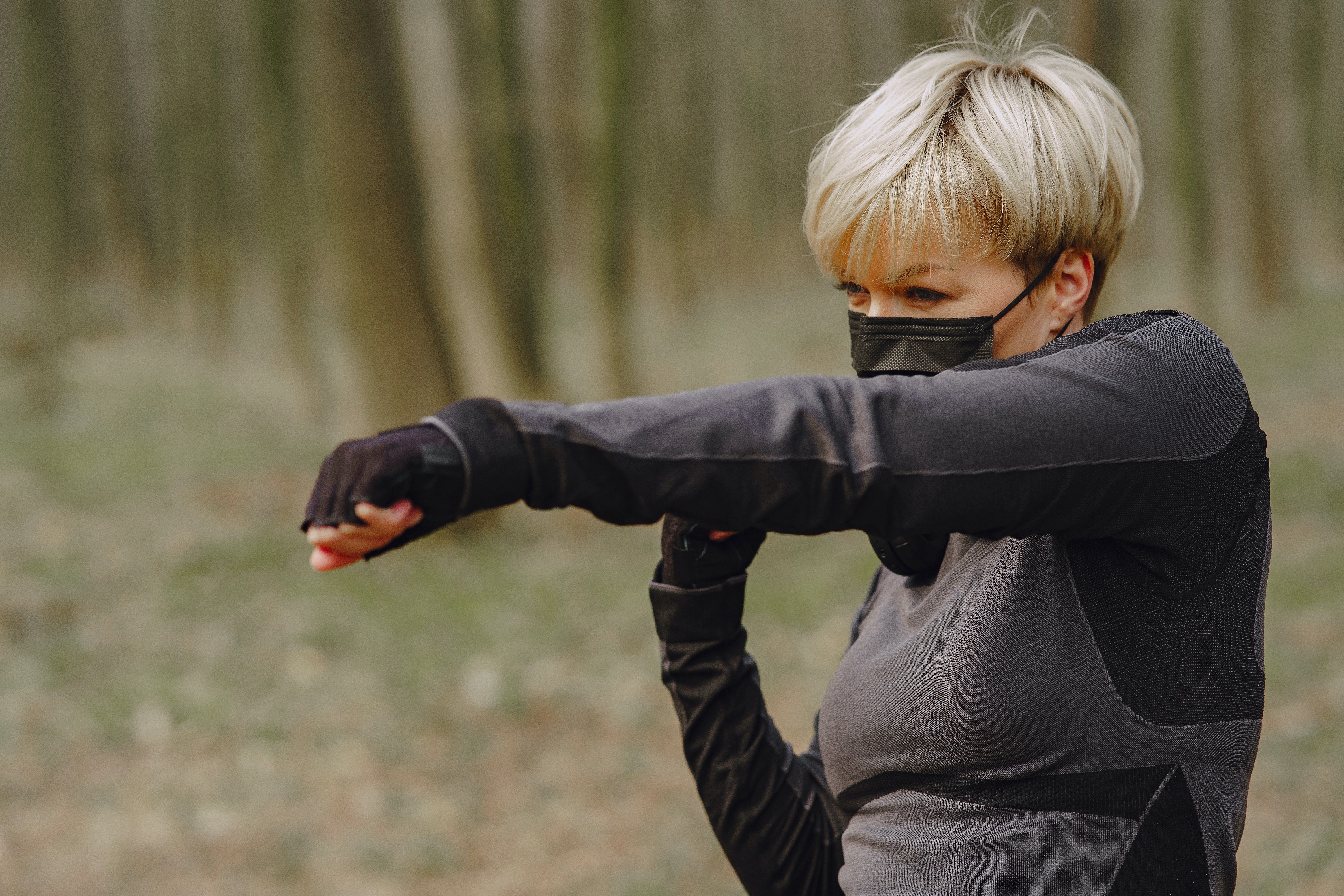 Strong Sportswoman Doing Punching Workout In Park 4127495